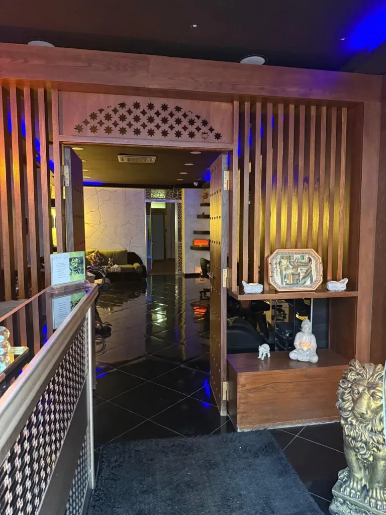 Carved wooden entrance and reception area of Arko Prestige Spa in Casablanca