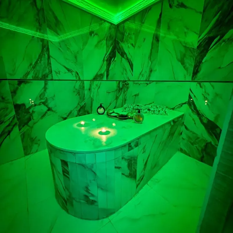 Marble hammam table under ambient lighting at Arko Prestige Spa